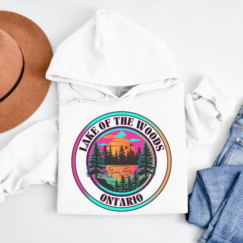 Featuring a stunning lake scene with a vibrant sunset, this hoodie captures the beauty of Lake of the Woods in Ontario, where tranquil waters meet the warm glow of a setting sun.